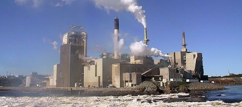 Pulp and paper mill with smoke, demonstrating Carbon pricing; Pan-Canadian Framework; stringency